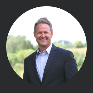 Dr. Marty W. Lindahl top rated knoxville dentist smiles standing in front of the rolling hills of east tennessee